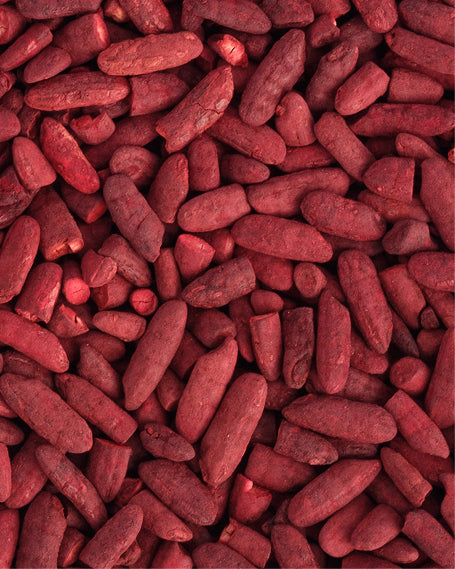 Close-up of red oval-shaped pieces of red rice yeast