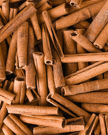 Close-up of cinnamon sticks in a pile