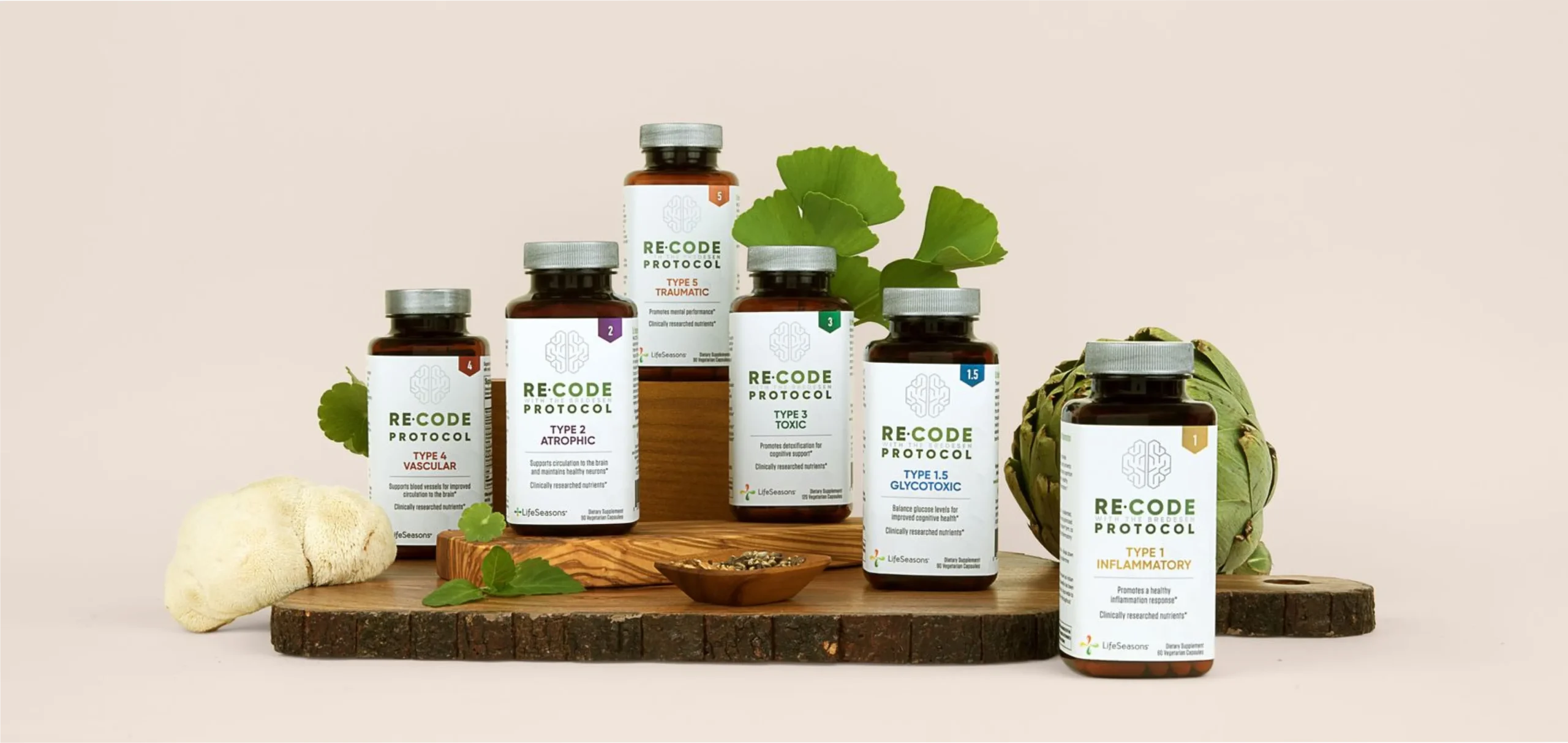 Collection of 'Recode Nutrition' supplement bottles on a wooden board with herbs and plants on a beige background.