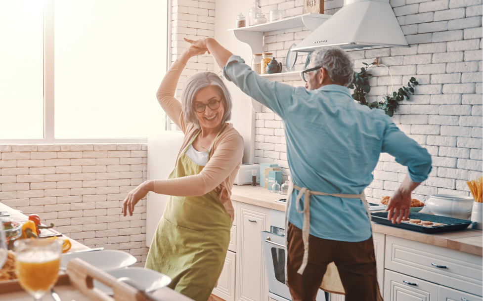 Senior couple dancing in a kitchen