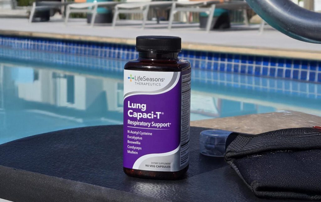 Lung Capaci-T supplement sitting next to a lap pool and goggles
